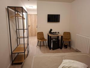 TV a/nebo společenská místnost v ubytování B&B De Scheldeberg