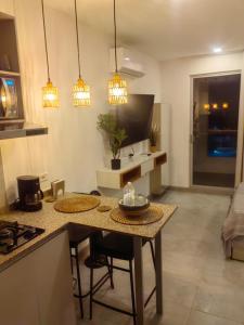 TV a/nebo společenská místnost v ubytování Apartamento con vista al mar y acceso a la playa