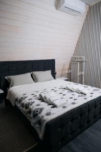 Giường trong phòng chung tại A-frame Marva