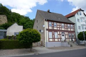a brown and white building on the side of a street at Blaue Gans in Oderberg