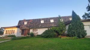 a house with a green yard in front of it at Pells Hostel in Regina
