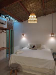 Postel nebo postele na pokoji v ubytování Casa mangarito - suítes