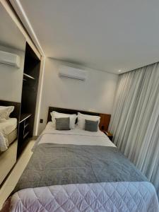 Postel nebo postele na pokoji v ubytování Resorts Porto Alto & Porto 2 Life