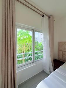 Ένα ή περισσότερα κρεβάτια σε δωμάτιο στο Bliss Homes at Fumba Town