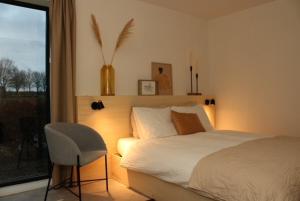 Ένα ή περισσότερα κρεβάτια σε δωμάτιο στο 't Holtslag