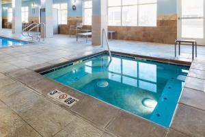a swimming pool with blue water in a building at Holiday Inn Express Hotel Twin Falls by IHG in Twin Falls