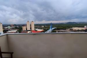 a view of an airport with an airplane on the runway at Aeroporto Gru, Ar Condicionado, Piscina+Academia 7 in Guarulhos