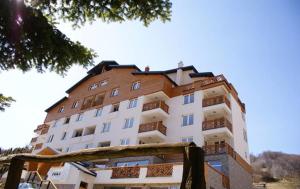 a large apartment building with a large at Apartman Foka Spa in Brzeće