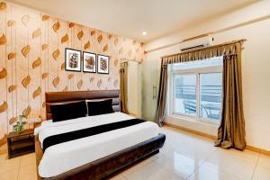 Ένα ή περισσότερα κρεβάτια σε δωμάτιο στο Hotel O DUNARA