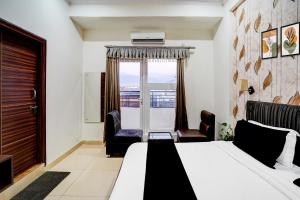 Ένα ή περισσότερα κρεβάτια σε δωμάτιο στο Hotel O DUNARA