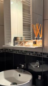 a bathroom with a sink and a mirror at Apartman Ilić in Divčibare