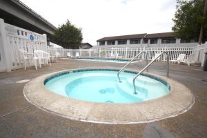 a small swimming pool in the middle of a building at EZ 8 Motel Old Town in San Diego