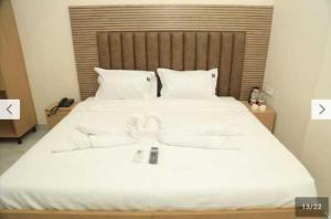 Postel nebo postele na pokoji v ubytování POP 84109D Hotel O Near Jodimetla X Roads