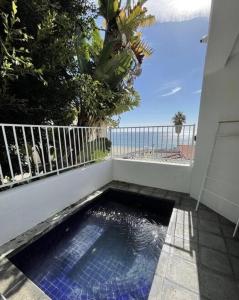 a small pool of water on the side of a balcony at Gorgeous Malibu Retreat with #Instaworthy Ocean Views in Malibu Beach