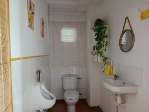 a bathroom with a toilet and a sink at El otro cielo Playamonte in Navarrés +44 photos