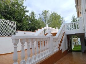 a white staircase on a house at El otro cielo Playamonte in Navarrés