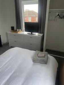 En eller flere senge i et værelse på Bridgewater Court 2 + 3 billeder