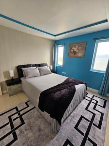 Ένα ή περισσότερα κρεβάτια σε δωμάτιο στο Portmore Paradise +11 φωτογραφίες