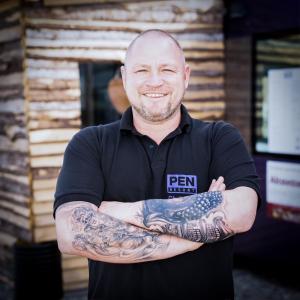 a man with a tattoo on his arms at PEN Smart Hotel in Türkheim