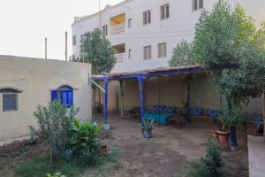 a house with a patio in front of a building at Deja house in Luxor +6 photos