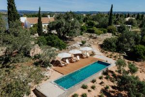 an overhead view of a swimming pool in a yard at Monte Do Alamo - Turismo Rural in Tavira