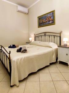 Postel nebo postele na pokoji v ubytování Casa Vacanze Il Piccolo Viaggiatore