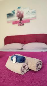 Postel nebo postele na pokoji v ubytování Casa Vacanze Il Piccolo Viaggiatore + 34 fotografií