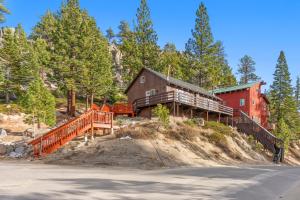 a house on the side of a hill with trees at HNC0691 - Tramway Treat home in Summit Village
