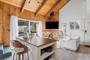 a kitchen and living room with wooden ceilings at HNC0691 - Tramway Treat home in Summit Village