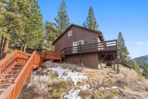 a house on the side of a hill with trees at HNC0691 - Tramway Treat home in Summit Village
