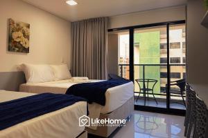 Ένα ή περισσότερα κρεβάτια σε δωμάτιο στο Move Tambaú |||