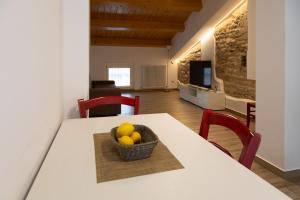 Телевизор и/или развлекательный центр в La Corte Residence