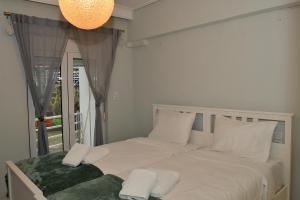 Postel nebo postele na pokoji v ubytování Anastasia Meteora Residence