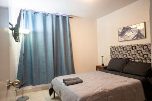 Una cama o camas en una habitación de Apt cerca de New City, Centro y frontera, zona río