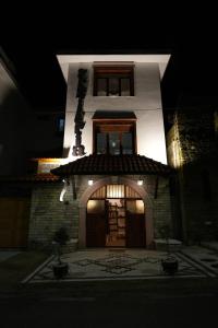 a building with a large door in front of it at Hotel Boutique Ergjeria in Gjirokastër
