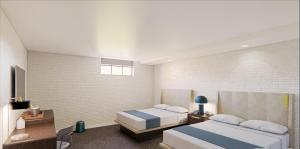 Giường trong phòng chung tại The Lantern Hotel Columbia