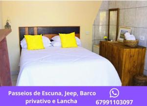 Giường trong phòng chung tại Pousada Bougain Ville Para-tí