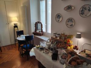 a room with a table with food on it at Casa Salvàn in Rodello