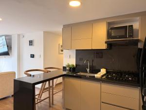 Η κουζίνα ή μικρή κουζίνα στο Apartamento Nuevo Central Piso 7 Terraza privada