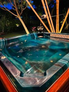 a jacuzzi tub in a car with blue water at Bambu Villas Wellness Center in Amatlán +68 photos