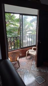 a room with a view of a balcony with two chairs at samargo in Cali