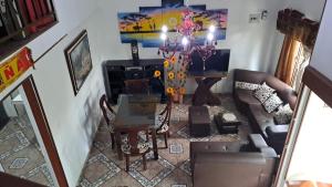 an aerial view of a living room with a chandelier at samargo in Cali +3 photos