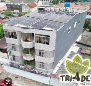 an overhead view of a building with solar panels on it at Apartaestudio 405 in Acacías