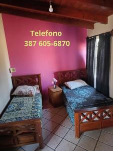 Postel nebo postele na pokoji v ubytování La Pachita