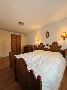 En eller flere senge i et værelse på Casa Vacanze Carano - El Me Tabià