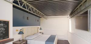 Giường trong phòng chung tại The Lantern Hotel Columbia +4 ảnh