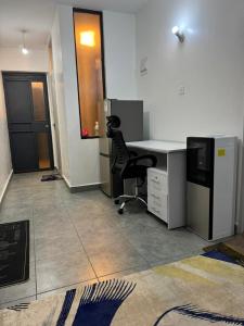 an office with a desk and a chair in a room at BonBon Residency in Kiambu