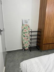 a small refrigerator in a room next to a door at BonBon Residency in Kiambu +5 photos