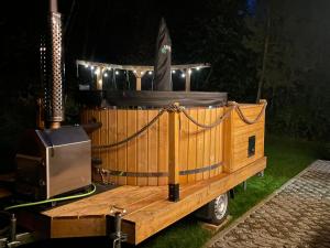 a wooden boat sitting on top of a trailer at Domek na Zagórze - domek całoroczny in Krasnobród