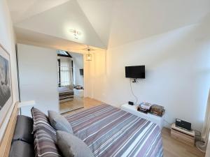 TV a/nebo společenská místnost v ubytování Appartamento Weissmatten